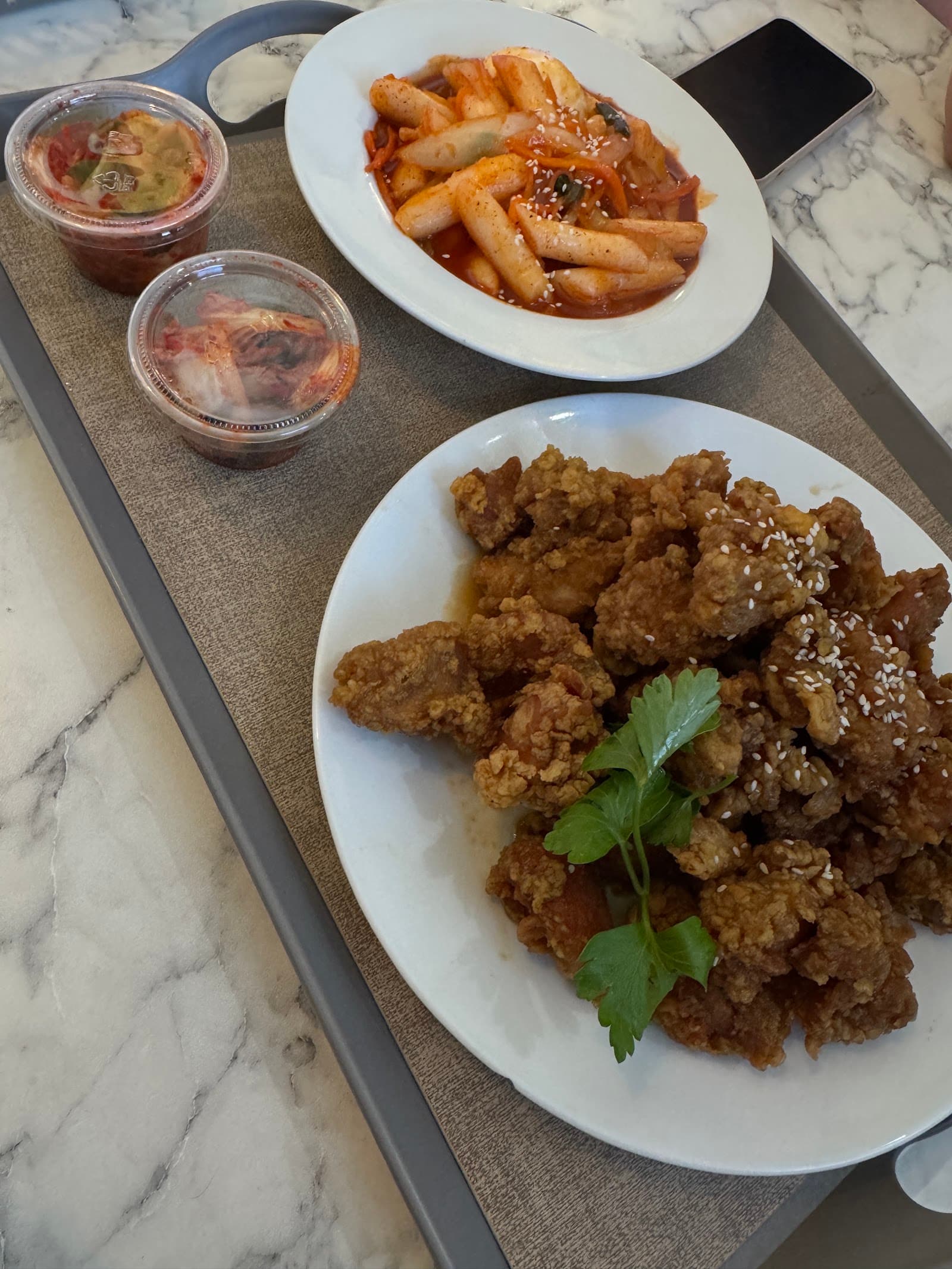 Soy garlic fried chicken with tteokbokki on the side
