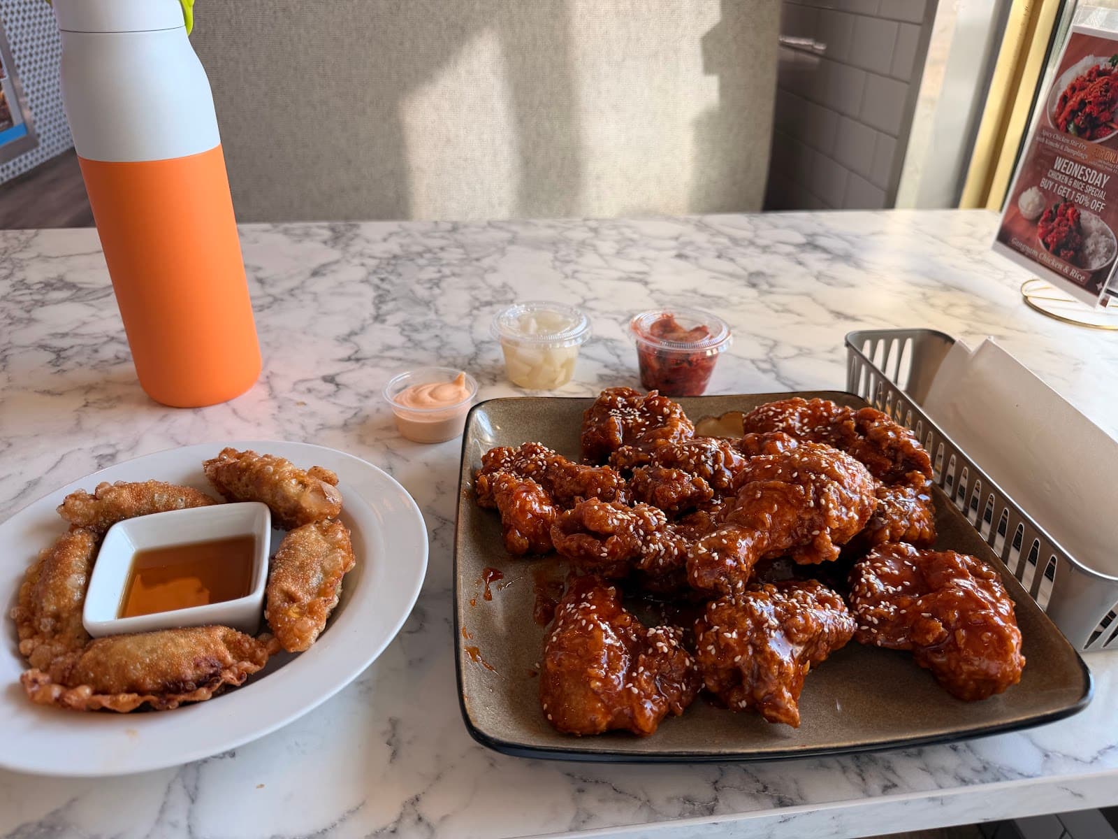 Fried chicken platter with dumplings and dipping sauce